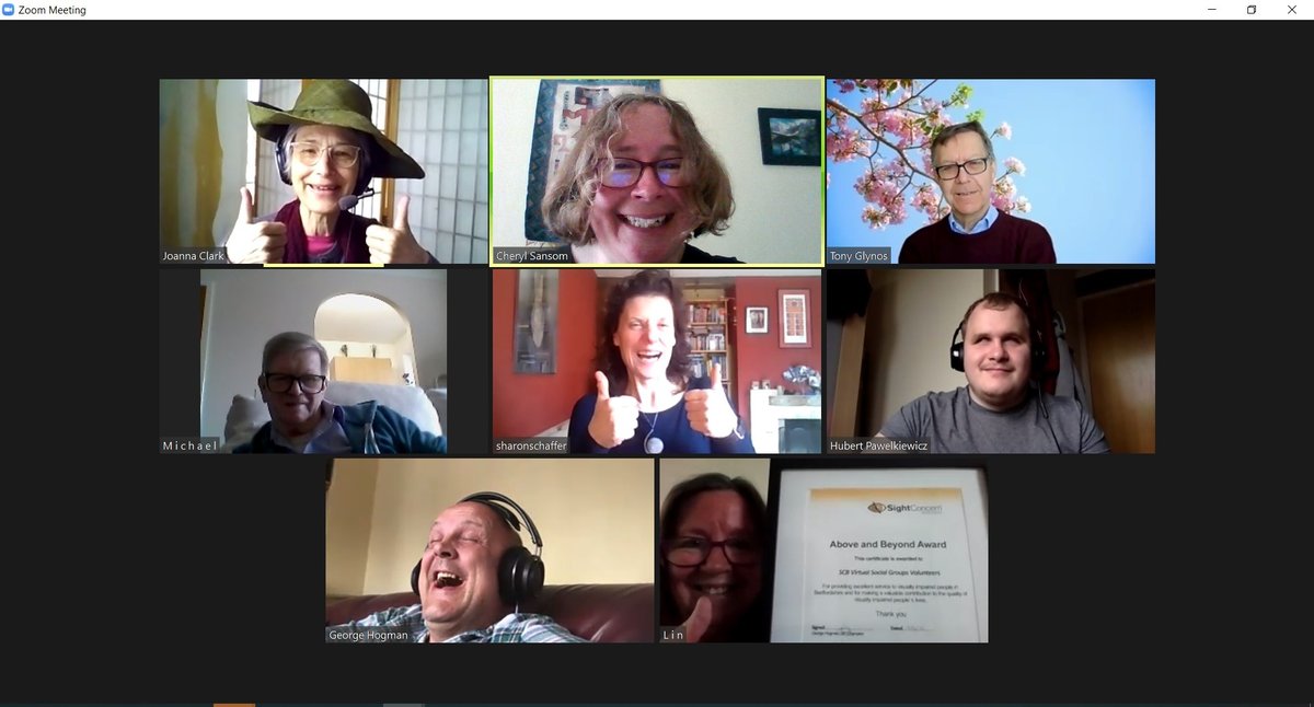 Photo shows some of the Tech Buddy team receiving their Award via Zoom – Joanna wearing a hat for the occasion!